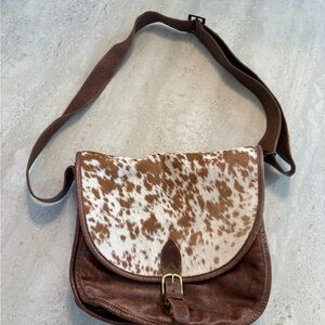 Genuine cowhide and leather crossbody bag.